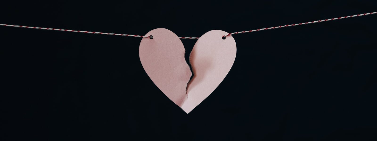 broken heart hanging on wire